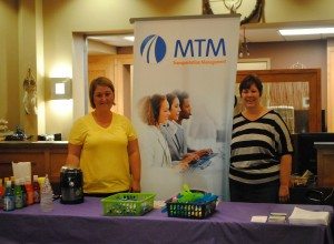 MTM Health, Inc.’s Christina Meyer and Melissa Workman attend the Bad River Health Fair July 17