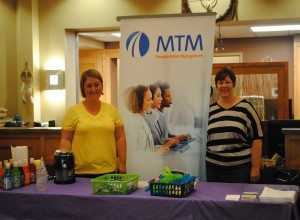 MTM, Inc.’s Christina Meyer and Melissa Workman attend the Bad River Health Fair July 17