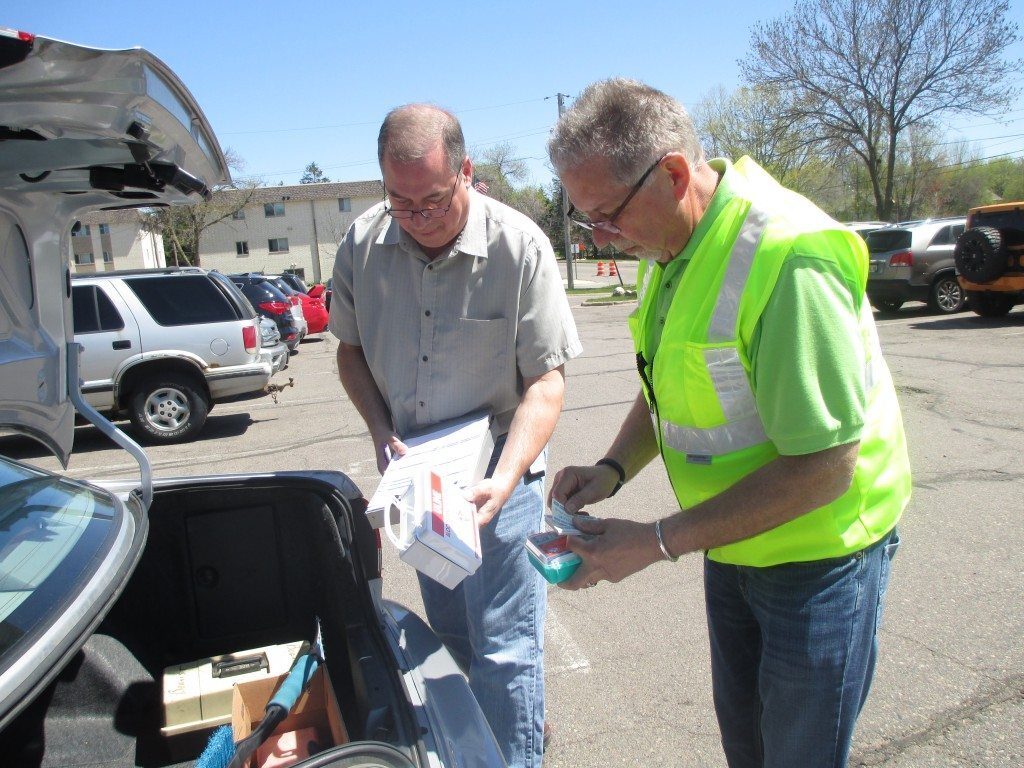 Two men inspecting a vehicle