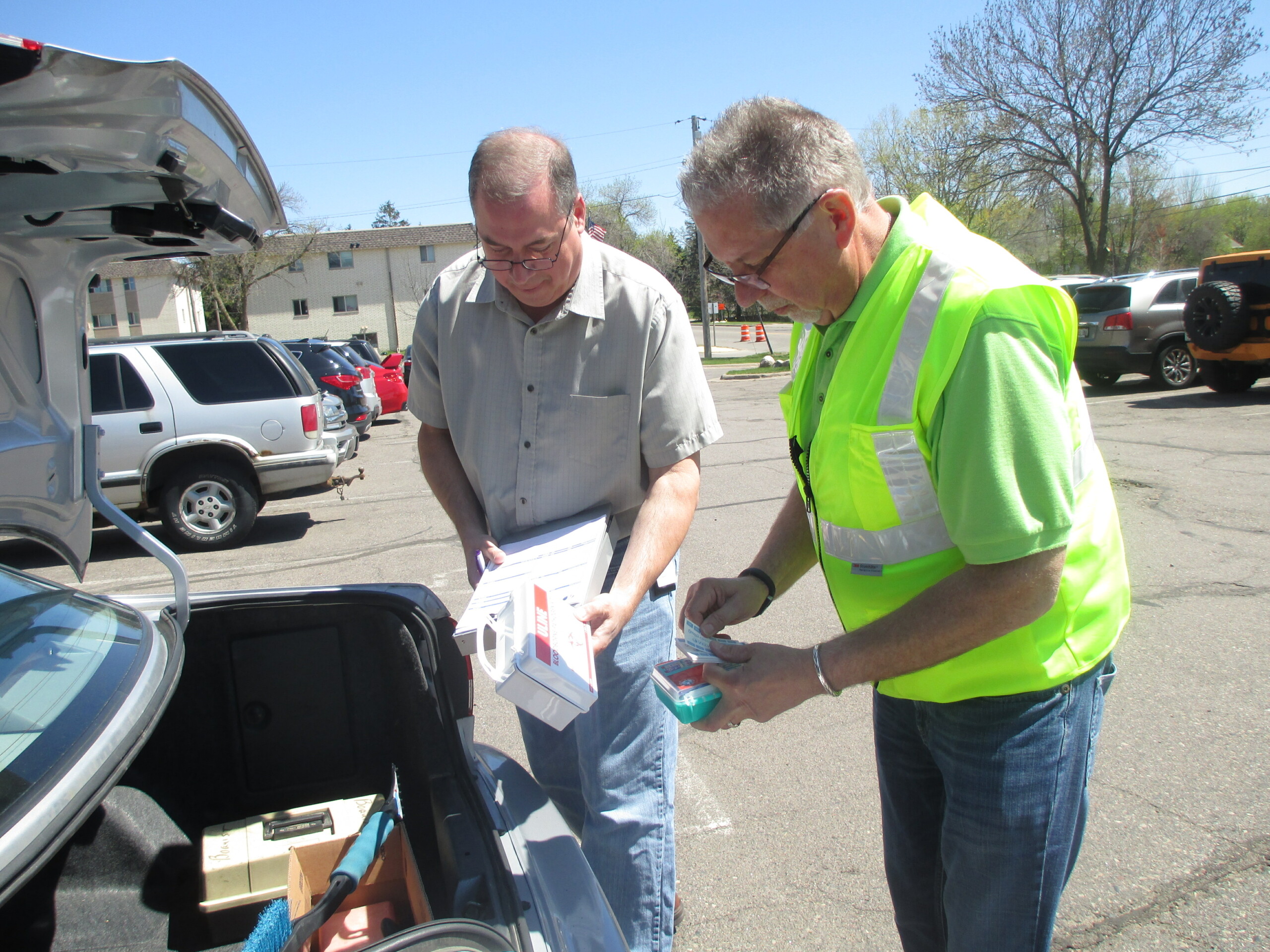 Two men inspecting a vehicle