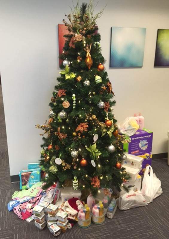 Christmas tree with donations under it for Nurses for Newborns