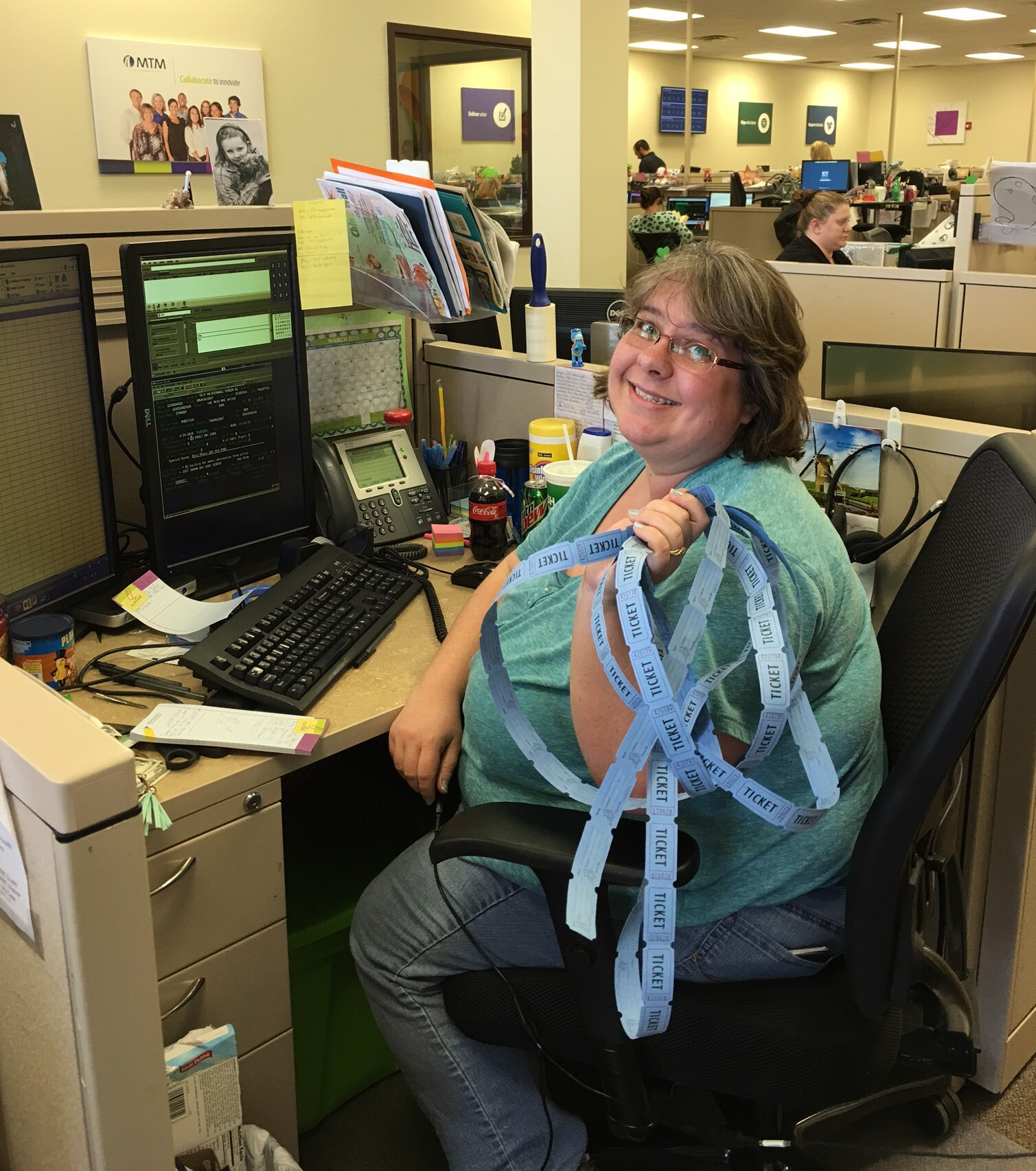 Virginia employee holding donation tickets