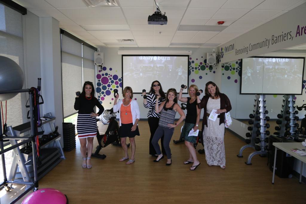 MTM employees posing in the gym