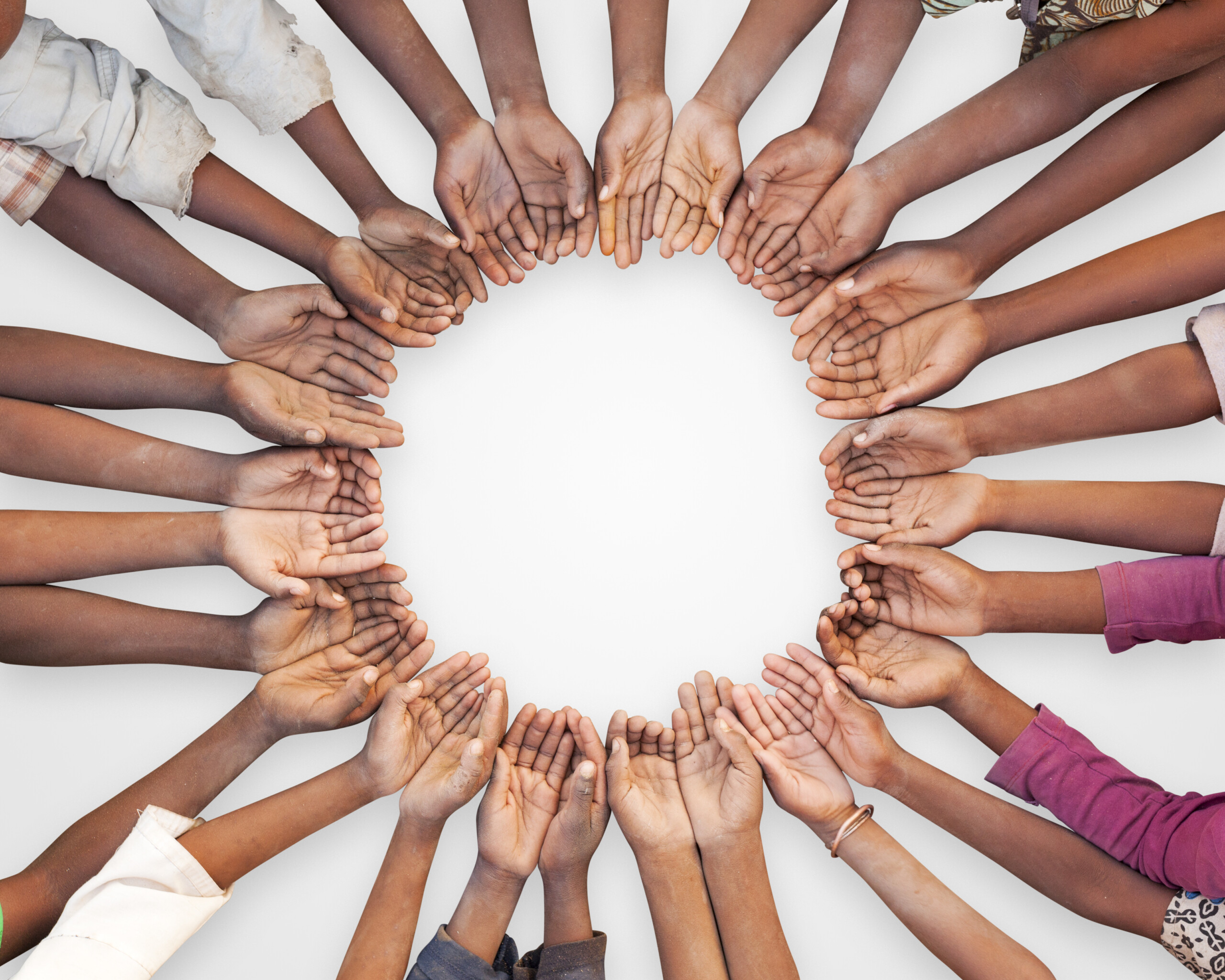 Group of hands make a circle in unity
