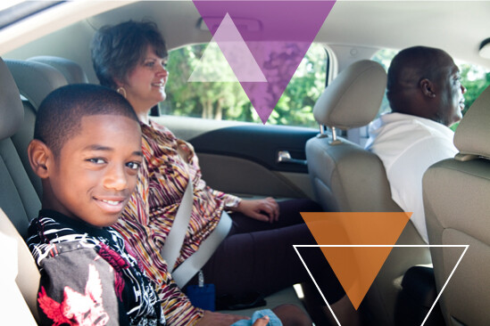 Child, guardian and driver in a car