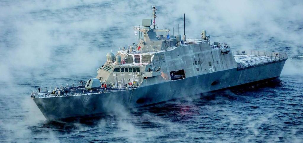 The USS ST LOUIS sails in the sea surrounded by fog.