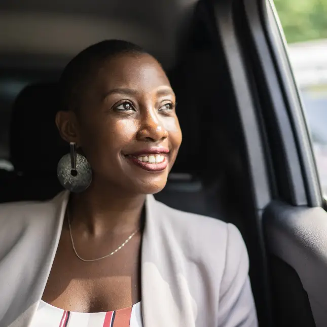 Female passenger riding in a car